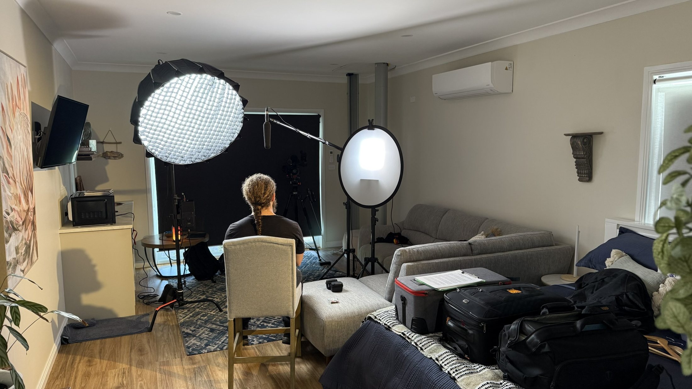 Wide view of the camera, lighting and sound setup for an ITV contributor interview
