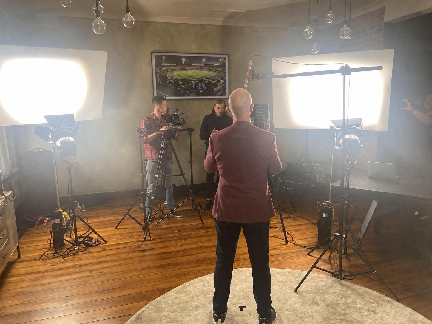 Presenter, camera crew, lighting and livestream equipment on the Melbourne set